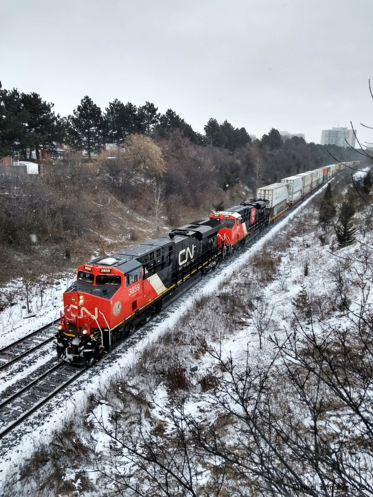 CN 3859 and 3894 lead a Westbound inter-modal en-route to the Brampton Inter-modal Terminal as the city of Vaughan experiences a light dusting of flurries.