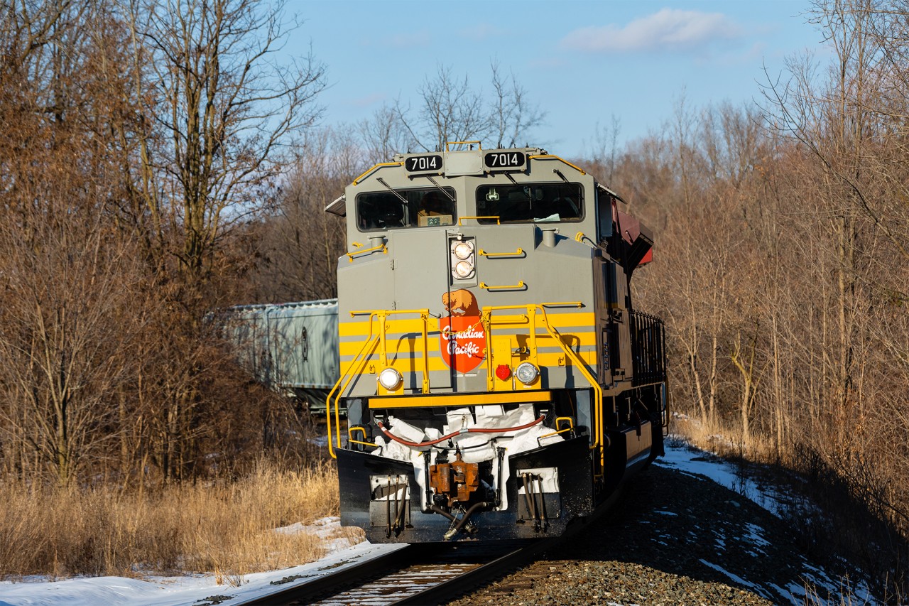 Easing down the mountain grade at Waterdown, Ontario with 12,000 tons on the drawbar, script-painted SD70ACu 7014 looks phenomenal in the afternoon sun. In the 1960s, the CPR emblazoned their locomotives with this very paint scheme. Today, a handful of Canadian Pacific's former SD90MACs, which were seemingly destined for the scrapper’s torch, now display the company’s proud heritage and roll on — serving a reminder of the railway’s significance both past and present. Simply put, Tuscan and grey is always in style.