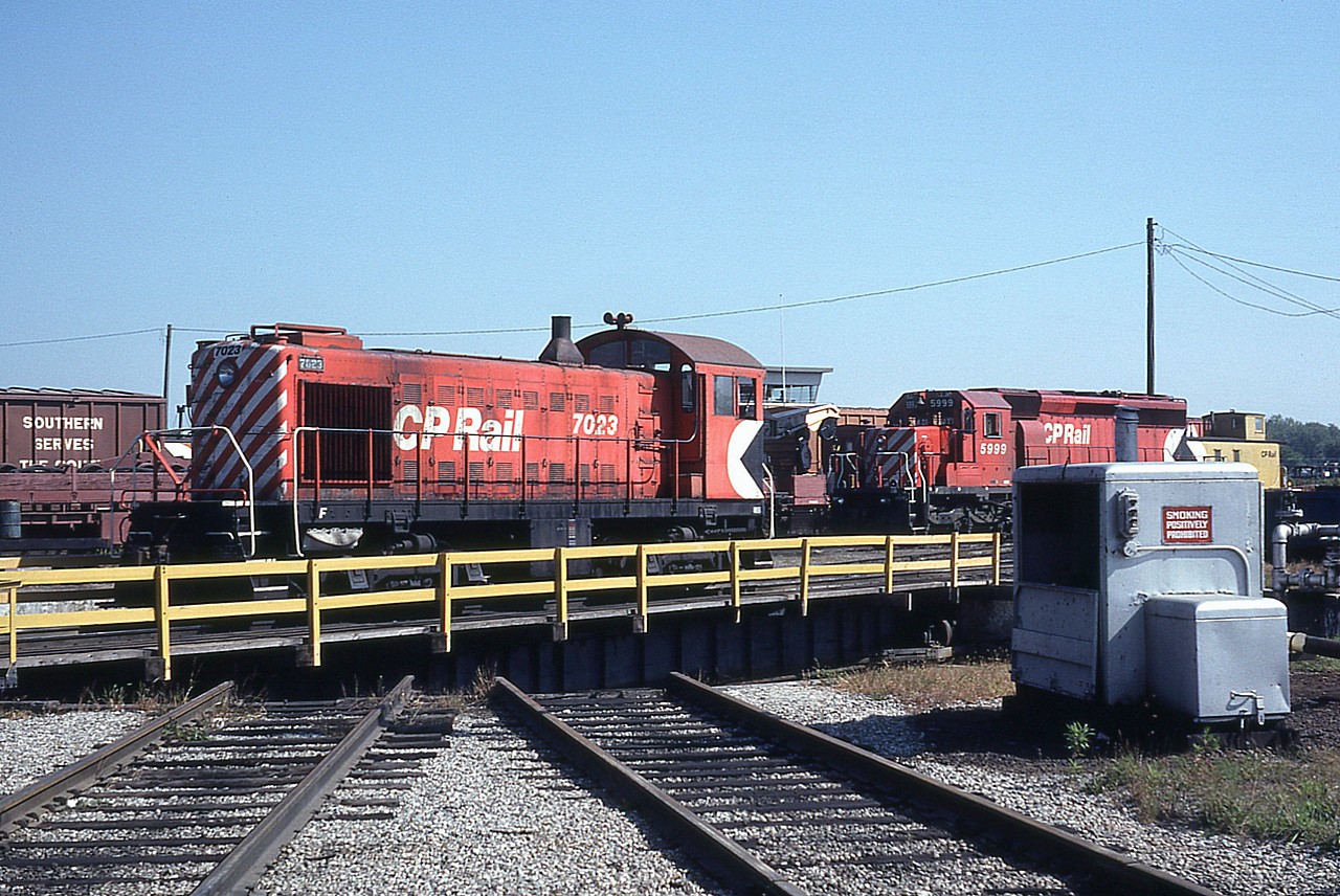 A beautiful sunny Friday afternoon and a visit to Windsor. Seen on the turntable is old S-2 CP 7023, nearing the end of its days. This series of ALCO switchers were all retired or sold not long after this photo. The Canadian Trackside Guide lists them all off the roster by 1986.