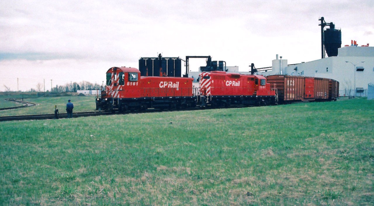 The CP Galt Job with SW1200RS 8161 and GP7u 1501 are working the large BF Goodrich tire plant in Kitchener on the Goodrich Spur in spring 1995. This was a regular if not daily switch by the crews during the week, which also serviced Al's Cartage on the same industrial spur. Like most things manufacturing in Kitchener, the years that followed were not kind, as BF Goodrich officially closed in summer 2006 with the resulting loss of 1,100 jobs. After sitting dormant for many years, the Goodrich Spur was officially severed from the Waterloo Subdivision during summer 2018. However, sightings this winter have confirmed that track removal equipment might have been placed there to remove the remaining sections of the once thriving spur.