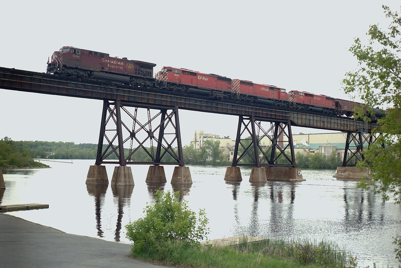 Pleasantly warm May afternoon. Spent some time along the Trent River by the CPR bridge, and it was fairly busy, with about 5 trains in 6 hours.
For awhile I was convinced that CP deliberately put an ugly unit on the lead of their trains just to annoy us trackside photographers. :o) Hee's a classic example on a westbound crossing the river. A grubby CP 9606 leading 3 reasonably clean looking Red Barns.. 9003, 9013 and 9001. All 3 Barns were sold yo J&L Consulting in late 2016.