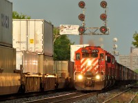 An EB rock train passes a WB stack train at Spadina Avenue on CP's North Toronto line, 9/14/12.