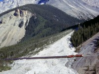 The WB Canadian crosses the Big Slide east of Field, BC, 8/17/77.  The slide shed here had not yet been built.