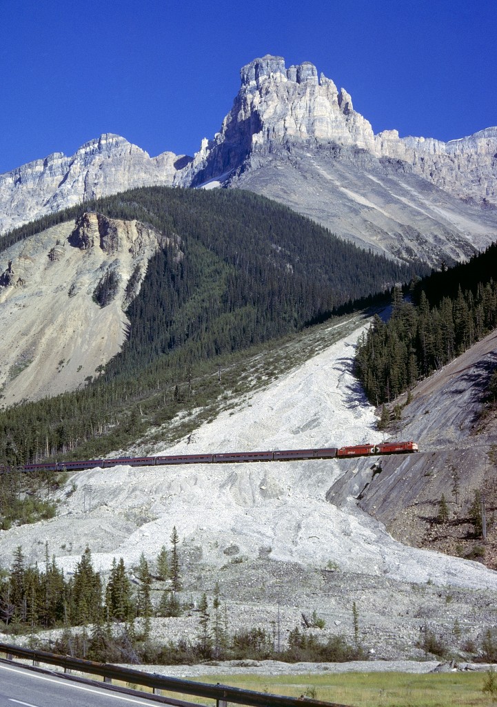 The WB Canadian crosses the Big Slide east of Field, BC, 8/17/77.  The slide shed here had not yet been built.