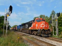 21st Century Railroading, CN 3212, A GE ET44AC bought in 2018 leads CN A421 through a pair of 'Vader' signal heads on the Grimsby Sub just east of St. Catharines.
