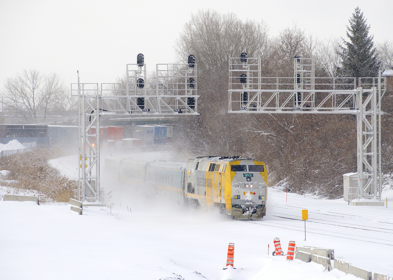 VIA 624 heads east on the south track of CN's Montreal Sub, with CN 120 visible in the background on the north track.