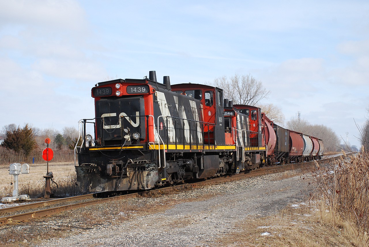 The crew of CN 514 had a short morning because all they did was run to Thamesville and back to Chatham.  Of course I went on a wild goose chase trying to find them before realising this but that's how it goes some times.  In hindsight I should have bailed off the 401 when I heard static on the scanner while going by Thamesville.  Thankfully they briefly stopped at the station in Chatham affording me time to get one shot of the train.  Here CN 1439 and 1444 are backing their 6 car train in to the siding east of Keil Drive South before calling it a day.