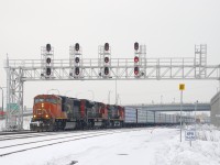 CN 324 with CN 5700, CN 8007, BCOL 4647 and 80 cars is ducking under a signal bridge at Turcot Ouest, on its way to St. Albans, Vermont where it will interchange with the New England Central Railroad.