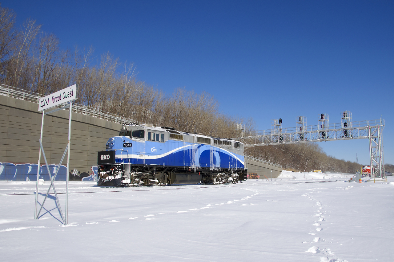 On a line that sees no regular EXO service, a light move of AMT 1341 is heading east as it passes Turcot Ouest. Barely visible at right is a parked CN 305.