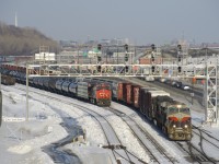 A rare daylight CN 529 has heritage unit NS 8101 leading (and NS 9709 trailing) and a decent sized train as it passes a CN 305 that has been parked at Turcot Ouest over two weeks now due to a protest on CN's main line along Tyendinaga Mohawk territory.