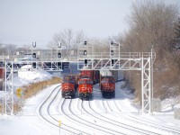 A trio of trains sit parked a bit west of Turcot Ouest; with the blockade of CN's Kingston Sub over, CN must have more traffic than crews can handle and trains were parked all over the place in Montreal this morning. From left to right are Q12031 28 (Brampton Intermodal Terminal to Rockingham, CN 2250 lead), Q12091 27 (Chicago to Rockingham, CN 3895 lead) and E27661 28 (Flint to Joffre, CN 5707 lead).