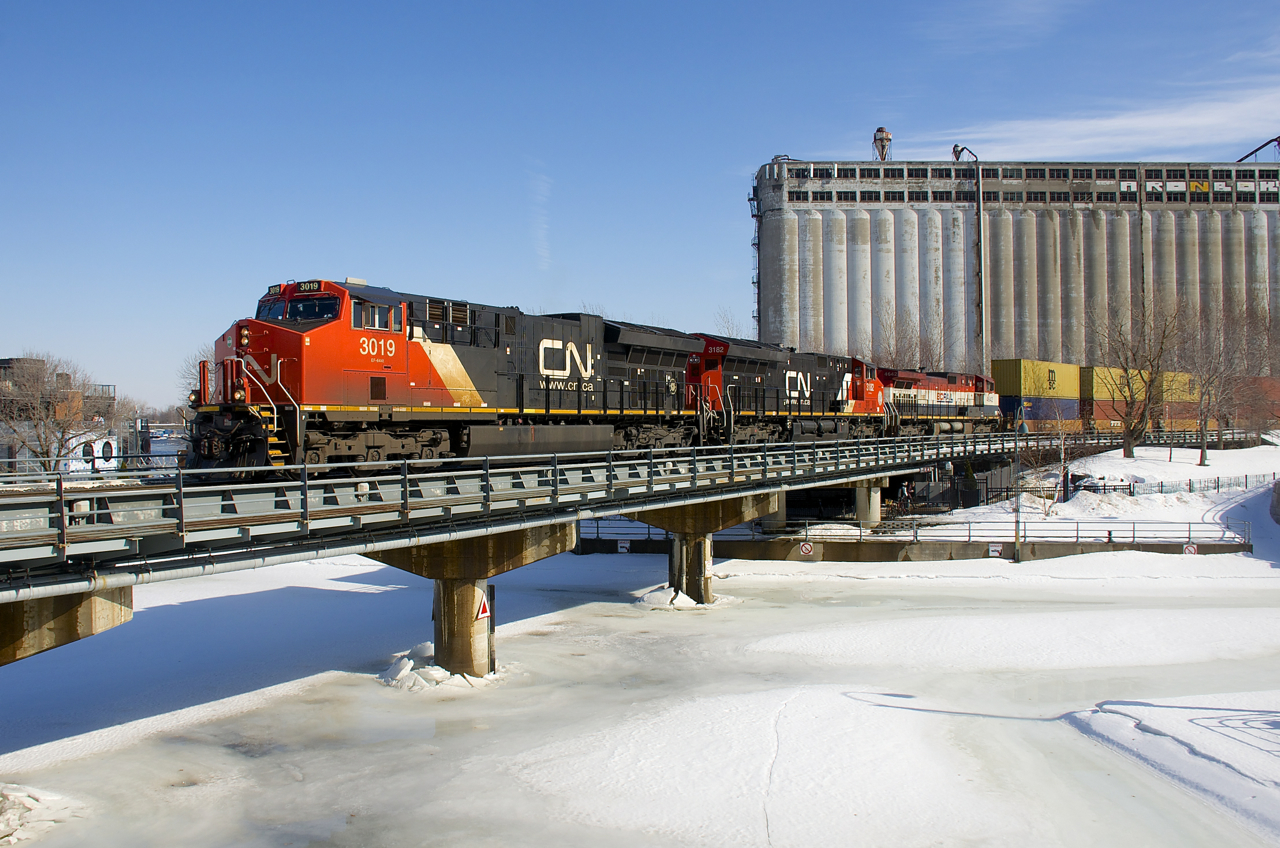CN 131 (full ID: Q13132-22) is nearly finished its run as it enters the Port of Montreal with CN 3019, CN 3182 & BCOL 4642 for power. Due to a blockade on CN's Kingston Sub, this train has taken a very lengthy detour, going north out of Toronto on CN and the Ontario Northland, getting back to CN rails at Noranda and then heading back south via the CN Val D'Or, St-Maurice, Lac St-Jean, La Tuque, Joliette and St-Laurent Subs.