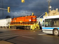 Meeting of the '81s.  RLHH 2081 shoves northbound with cars from Ingenia as Brantford Transit 10081 waits to turn left on to Darling Street heading for the downtown terminal.  An intense storm had just passed and I frantically had to adjust the camera settings when the sun made a brief, well-time appearance making a very dramatic scene.   