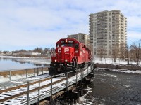 I have heard this train on the scanner for a few months running the Pender to Wolverton job but in the last week it has swapped over to T72.  Former MILW 2066 and SOO 2066, GP40-3, CP 4007 leads a 3200 foot auto rack train across the bridge by the dammed up Speed River on its way to the Toyota plant. Oddly enough this train would go in to emergency about 100 feet up the tracks and was a cold wait to get back to my truck on the other side.