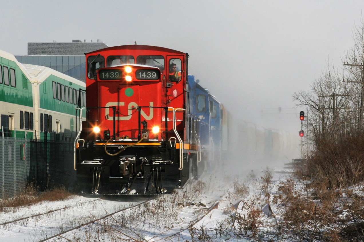 CN L568 is approaching Park Street as it departs Kitchener westbound on the Guelph Subdivision during a day that had its fair share of snow squalls. The consist included; CN 1439, GMTX 2279 and GMTX 2289.
