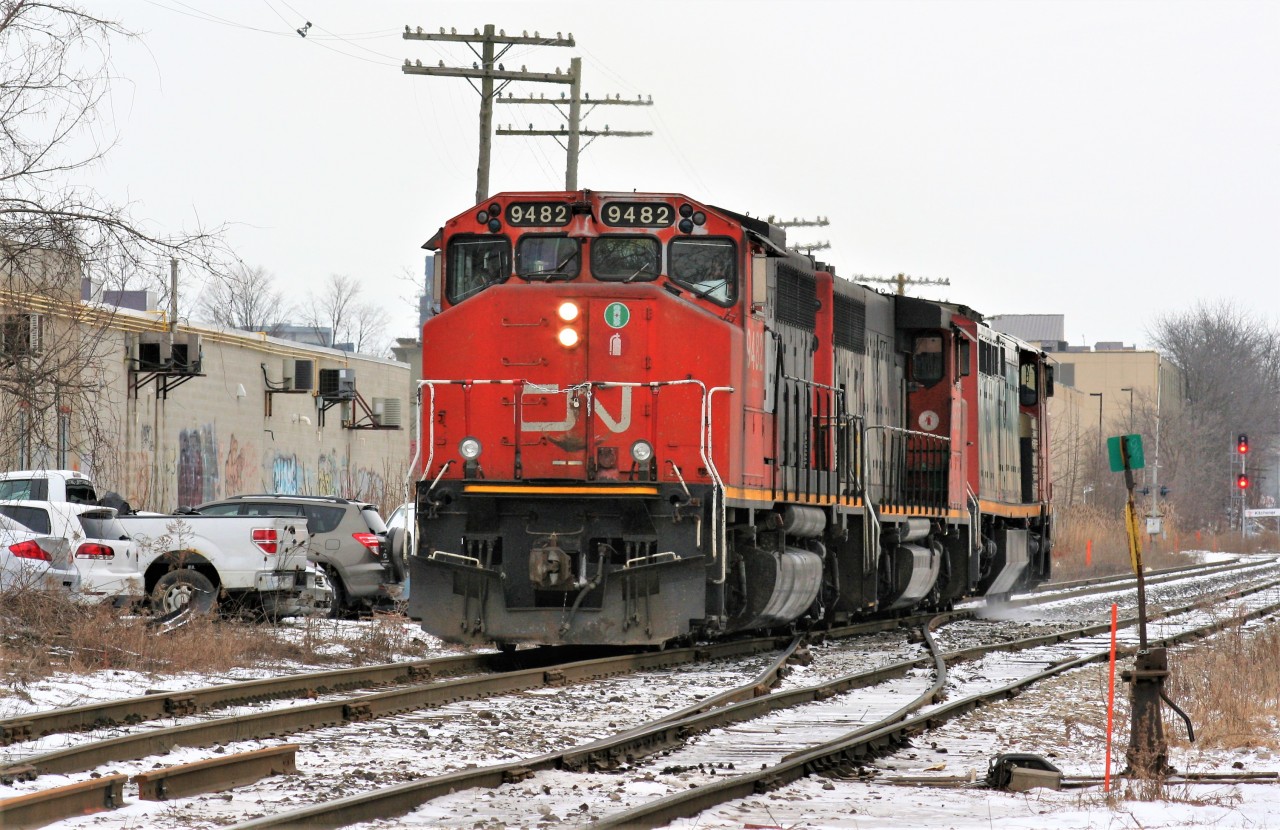 CN X431 with 2427 has completed lifting the power from the previous night's A431 at the Kitchener yard that consisted of 9675 and 9482. The trio is seen reversing on the mainline towards the east end of the yard by the crossover switches at Mile 62.14 Guelph Subdivision. Shooting an eastbound train from this side of the tracks at this time of day is virtually impossible with sun, so a cloudy afternoon such as this works the best, however getting any CN road power here is also difficult as 431 was predominantly nocturnal during 2019. While it was already good enough photographing 431 in daylight on this day, history wasn't far behind as CN removed these cross-over switches during the fall changing this scene forever.
