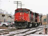 CN X431 with 2427 has completed lifting the power from the previous night's A431 at the Kitchener yard that consisted of 9675 and 9482. The trio is seen reversing on the mainline towards the east end of the yard by the crossover switches at Mile 62.14 Guelph Subdivision. Shooting an eastbound train from this side of the tracks at this time of day is virtually impossible with sun, so a cloudy afternoon such as this works the best, however getting any CN road power here is also difficult as 431 was predominantly nocturnal during 2019. While it was already good enough photographing 431 in daylight on this day, history wasn't far behind as CN removed these cross-over switches during the fall changing this scene forever. 