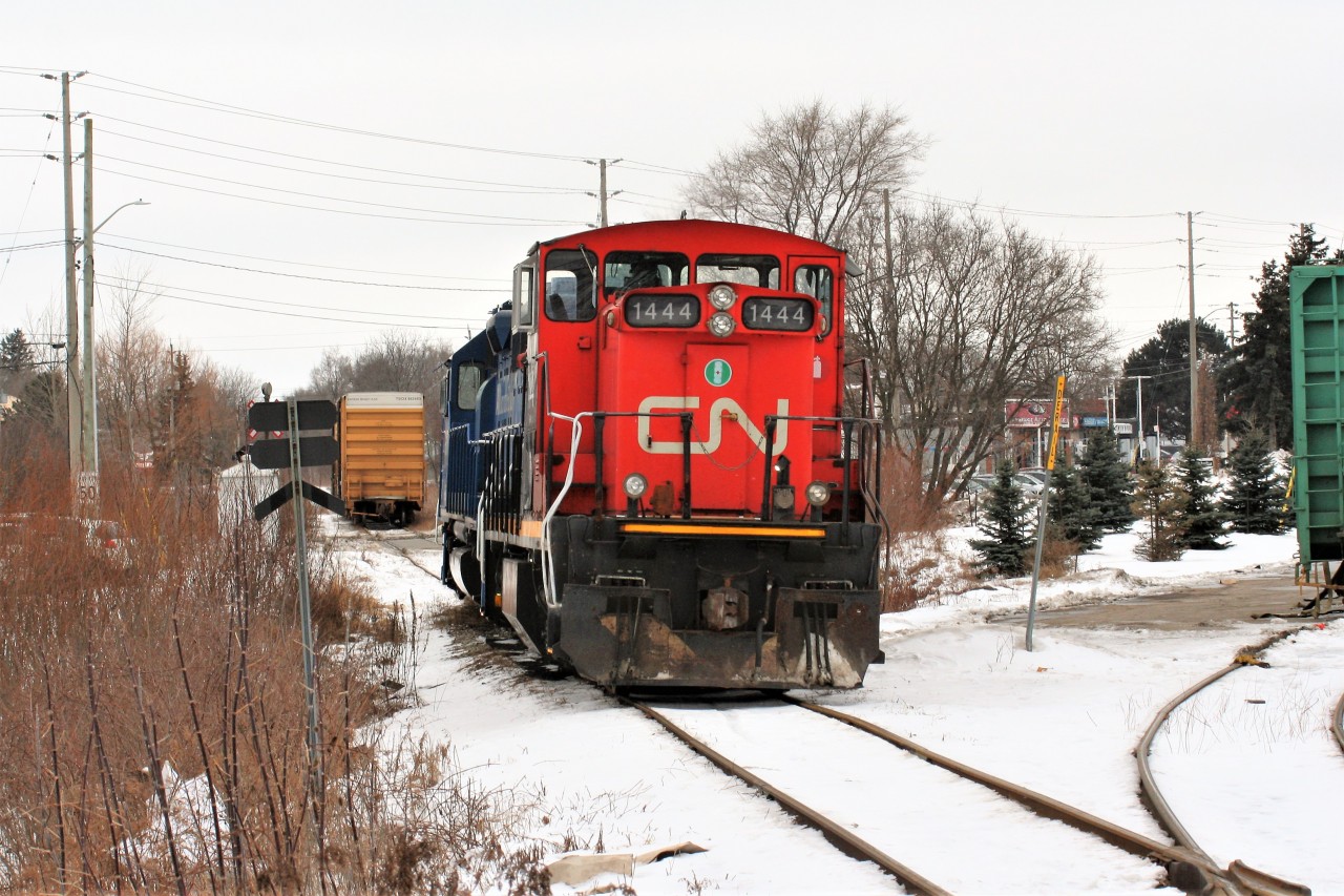 Family Day weekend one year ago....

CN 1444 and GMTX 2695 are viewed at Mile 19 of the CN Fergus Spur in Cambridge during a bitterly cold afternoon. This is the originating location of train L542, which works industries on the Fergus Spur and in Guelph during the week. The spur to the right is the Hunt's Logistics facility.
