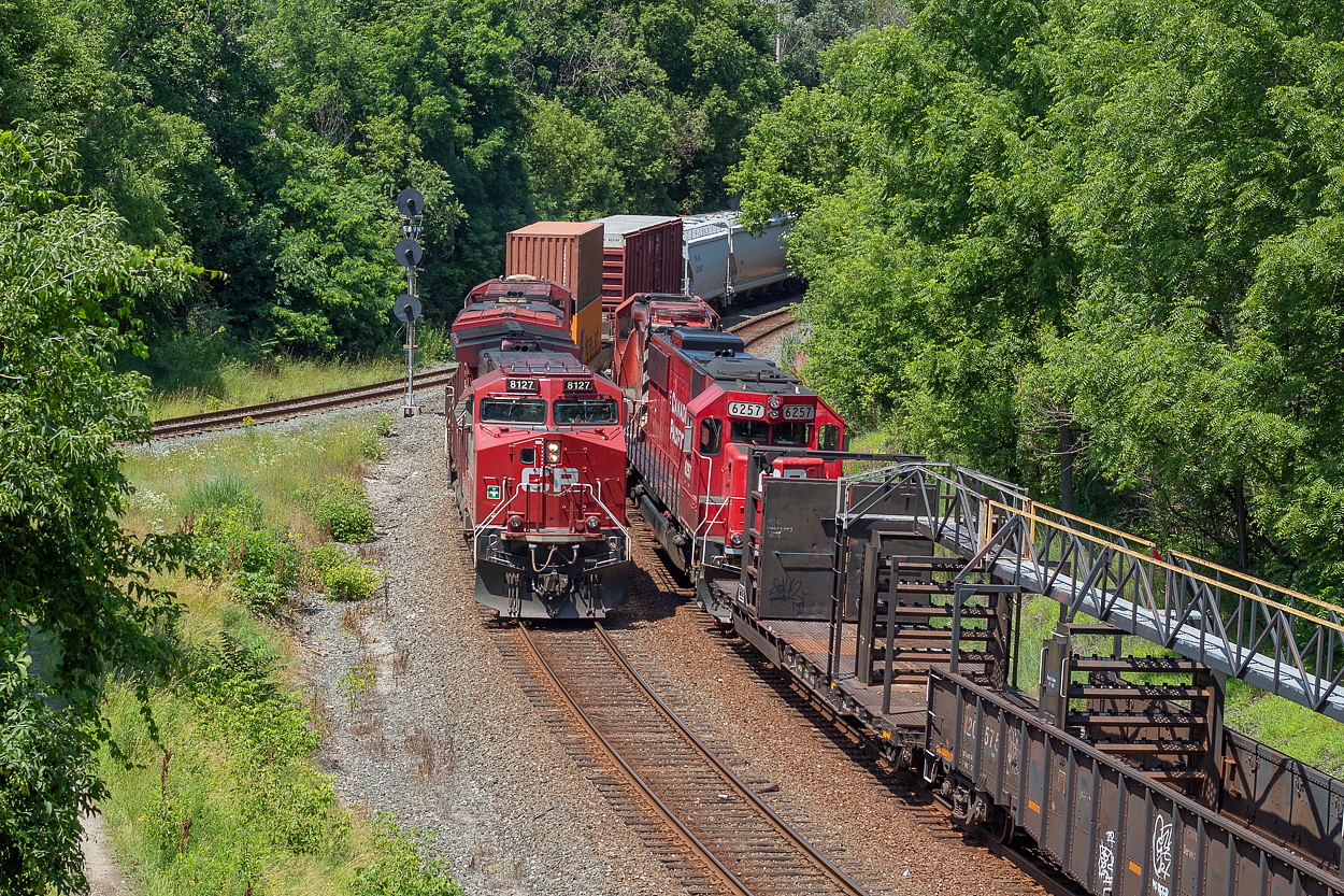 To offer a contrast in views from Jason Noe's recent shot of a southbound heading into Aberdeen Yard, here is a view from the same bridge some 24 years later. The trains are on different tracks, of course, but you can see changes such as the double tracking and search lights. Quite a bit of vegetation has grown in too. This was a rolling meet between the southbound 246 and a rail train that had been setting off rail in the area all morning.