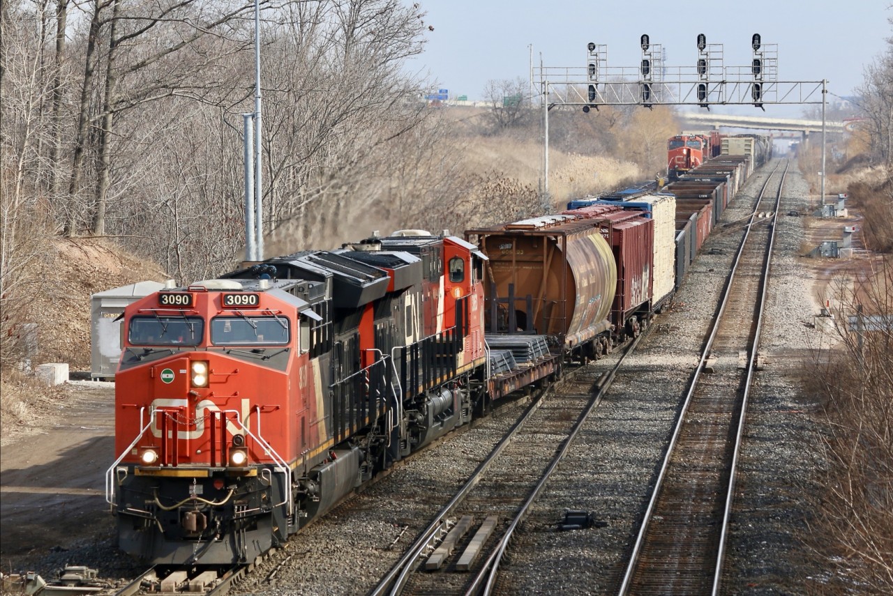 CN train 435 is hot on the heals of a westbound stack train that I'm guessing was 149 (it had Mid train DPU and didn't work Aldershot so unsure). CN 435 is seen rolling through the crossover at Snake so it can get around 421's train. CN 421 can be seen in the background and has just finished dropping a GMTX GP38 for the local crew to pick up. It was a pretty busy Monday morning with 148 out of sight lifting in the yard and 422 nearing Hamilton.