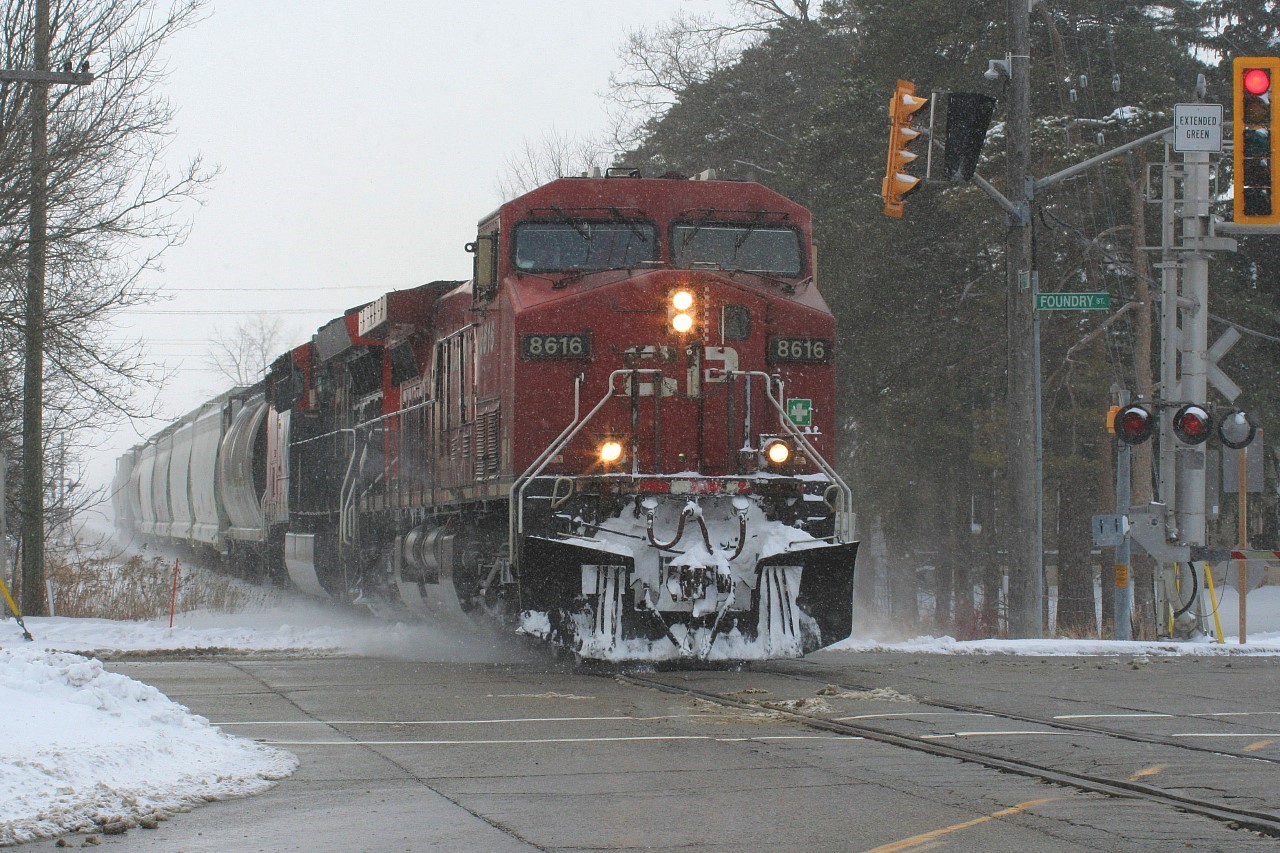 This hobby is always full of firsts, it just depends on how long it takes one to witness theirs. This past Friday certainly had a main event feel to it, as CN L540 departed Stratford for a return to Kitchener with CP 8616 in the lead. Previously, CN 533 had died the night before in Kitchener and the trailing unit was CP 8616. CN L540 would take the two GE's and a block of cars west to Stratford to lessen the congestion in a full yard at Kitchener. While it was rare enough for CN L540 to venture west of Kitchener, it was even more layered as it would take 533's power, with one unit being CP 8616. CN L540 is seen stopping traffic in all directions as it heads eastbound through Baden returning to Kitchener. So for me this was the first time I had ever photographed a CP unit leading a train on the CN Guelph Subdivision.