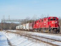 TE11 has just set out from Welland Yard, with the typical transfer traffic in tow for CN and Trillium. Their first stop is typically Feeder Yard for Trillium, and they access it by pulling ahead off the Hamilton Sub onto Rusholme Siding, and then shoving down the Trillium Cayuga Spur (pictured in the foreground). The head end traffic pictured is all traffic being returned to CN at Southern Yard. The first two hoppers are empties from Washington Mills in Niagara Falls, and one of those maroon/burgandy (I am not good at colours) 3800 cu.ft. CN hoppers is fairly typical for Washington Mills traffic. The following six hoppers and two black and white tanks are from Innophos in Port Maitland, and also heading to CN at Southern Yard. TE21 serves both Washington Mills and Innophos twice weekly at night. I <a href="http://www.railpictures.ca/?attachment_id=39733" target="_blank">shot this TE11 on its return from Southern Yard</a> as well, on the CN Stamford Sub. 