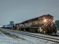 <b>The changing face of 555...</b> After a less than a year of being based out of Hamilton and using Hamilton yard power (example <a href="http://www.railpictures.ca/?attachment_id=37479" target="_blank">here</a>), 555 has a completely new face. It's once again based out of Aldershot and is now using big road power. The power from 570 becomes 555 at 2000 daily, bringing traffic from Mac over to Hamilton via Aldershot. It returns Hamilton traffic via Aldershot to Mac on the following day's 570. 551 has now entered the fray in Hamilton as well, serving customers on the Grimsby Sub on Sundays and Wednesdays I'm told. I heard them in Hamilton from about 1630 to 2130 on this recent Sunday, for example. <br><br>It was snowing/raining (quite frankly not sure what to call it) lightly at the time, and I was out there with an umbrella over top of the camera to keep it dry while I fired off some shots. Not sure if the hogger took pity on me, or if he's a railfan at heart, but the class lights were a cool touch.