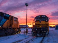 An assorted of Ontario Northland power slumbers beneath a spectacular sunrise at Englehart, ON.