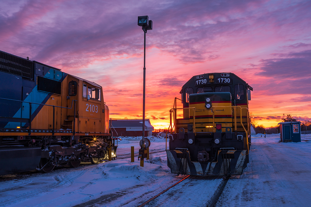 An assorted of Ontario Northland power slumbers beneath a spectacular sunrise at Englehart, ON.