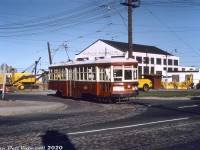 TTC Peter Witt streetcar 2766, operating on a Sunday fantrip, is seen posing outside Townsley Loop off Old Weston Road north of St. Clair Avenue on the morning of September 6th 1964. By this time, the TTC's University subway line opening earlier the previous year had nixed the old Dupont streetcar line and reduced demands of the streetcar fleet, notably affecting the remaining old Peter Witt cars. They were kept around as spares, but saw infrequent service and retired the following year in 1965. In the meantime, they were popular for fantrip charters, a number of which were run in 1963-65 with some of the remaining units, including cars 2742, 2766, 2858, 2868, and 2884. Even after its July 1965 retirement, TTC kept car 2766, which would later return in the 70's for Tour Tram service and is still retained by the TTC today.<br><br>Townsley Loop was located on a small parcel of land at the north-west quadrant of Old Weston Road and its namesake Townsley Street, by this point mainly serving as a spot to short-turn St. Clair streetcars (it remains today, but with tracks removed and serving as a bus loop). In the background is Construction Equipment Company Ltd, a local construction equipment and tool sales, service, and rentals dealer located at 404 Old Weston Road. According to old promotional materials, they had branches in Toronto, Montreal and Halifax, and dealt with small-to-medium sized equipment like backhoes, bulldozers, cable shovels, cranes, mixers, compressors, etc for local construction, road work and such. They had a rail spur off CP's MacTier Sub at one point (although a 1966 timetable lists them as "Godson's"). It appears the property was redeveloped around 1976 into the current commercial retail building there today, presently home to a flea market.<br><br><i>John F. Bromley photo (duplicate slide), Dan Dell'Unto collection.</i>