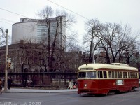 A gloomy February day in 1966 finds TTC PCC 4601 (an ex-Cincinnati A10-class car) operating on a Kingston Road run, heading westbound on Queen Street crossing University Avenue. Visible in the background is Osgoode Hall (dating from 1832) juxtaposed with a more modern piece of architecture: the new iconic Toronto City Hall, that officially opened just a few months earlier in September 1965.<br><br><i>John F. Bromley photo, Dan Dell'Unto collection.</i>