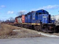 This short lived train was kind of interesting. It operated with shared power from both SOR and CN and ran between Hamilton and Nanticoke and return, with steel loads traveling to Hamilton on cars specially converted by CN. I believe union issues eventually killed the train but not totally sure. I'm glad I caught a few times at least. Here the train has left Hamilton yard and is now traveling on the H&NW sour to Stelco to drop the loads.