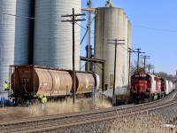 I've never seen the employees at Ardent so quick to grab the cut of cars off T14. SOO 4410 has just backed onto its train after switching out the Ardent elevator. The elevator employees have already attached the pulley to the other end of the cut of cars and are releasing the air and hand brake. Within the hour all four cars will be emptied and and left beyond the unloading Shute, ready for next weeks lift.