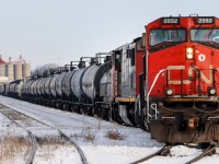 CN C44-9W 2552 and CN C40-8M 2430 shove cars into one of the storage tracks at CN London East on the Dundas Subdivision.  This photo was taken at Egerton Street in London Ontario.