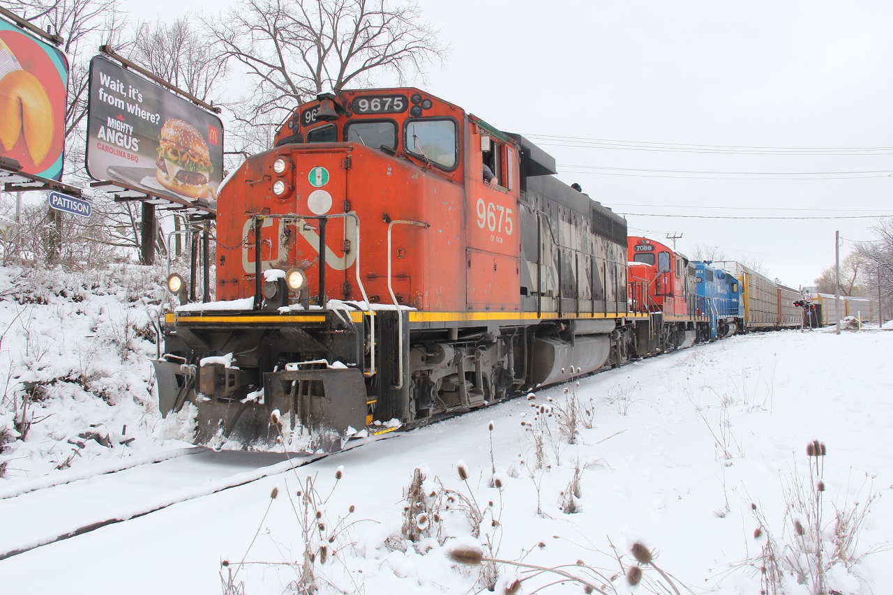 Piggybacking off of Jason's shot, CN L568 heads southbound towards the CP/CN interchange, clearing the rails of snow during the remnants of a late season snow blast. The train is just past Victoria St., south of the main.