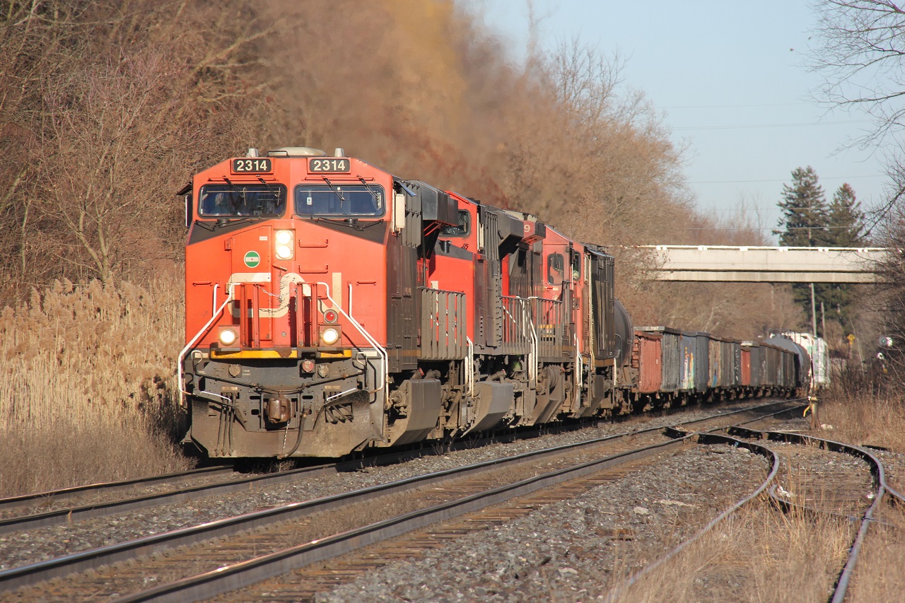 CN 397 climbs the grade at Copetown with a heavy train. Power was CN 2314-8882-2129-2403. If only the trailing two units were leading.