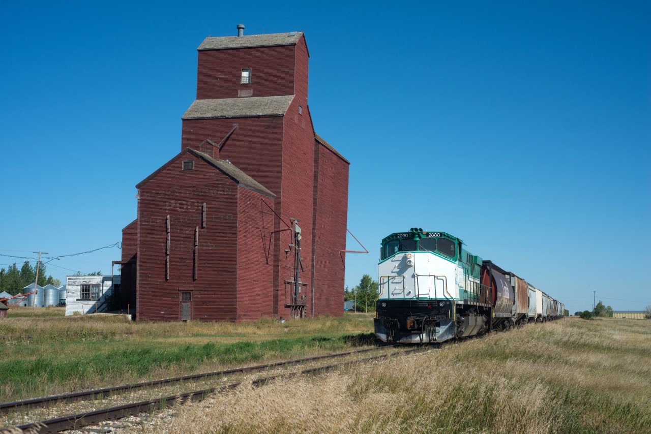 GW Rail M420 #2000 passes the elevator at Viceroy Saskatchewan on a beautiful September afternoon.