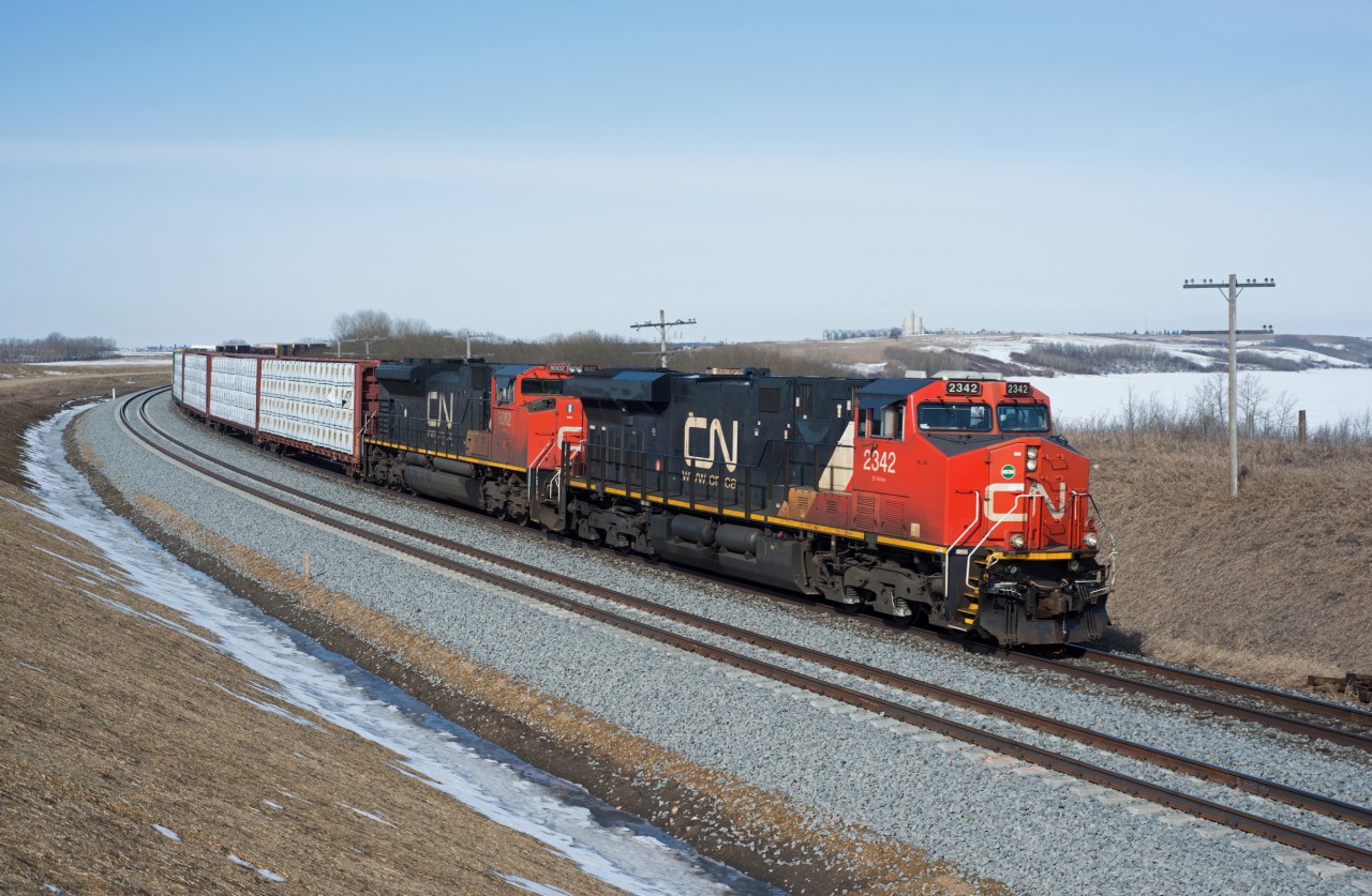 CN 304 drifts downgrade past the recently completed section of double-track between Biggar and Newton.