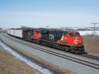 CN 304 drifts downgrade past the recently completed section of double-track between Biggar and Newton.  