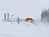 High winds and fluffy snow made for a pretty miserable 10 minute wait, but it was well worth it. ONR 2104 with train 214 to North Bay busts through the heavily drifting snow of the Northern Ontario tundra. 