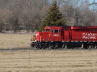 After running down the CP Waterloo Sub to interchange cars at Southern Junction with CN, I hear on the scanner that 2242 W is off Back Track Switch Galt and is ready to Highball west to Wolverton. It’s sunny out and it’s a westbound in the afternoon so a typical shot of a CP local in this area didn’t amuse me at all so a quick turn off Trussler road to a side shot location just east of the signal into the yard was what I was looking for in this light. It was only a 10 minute ride from Galt to Wolverton with their 7 car train so I didn’t have more then 2 minutes to set up for a pan shot. Lucky lightning conditions were great so it wasn’t an issue to tune up the camera for the shot of this GP20CECO at a steady 15 mph.  