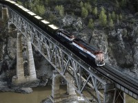 I found an old photo of this bridge, the Fraser River Bridge, taken while under construction that was dated 1930. In this 1995 photo, southbound BCR 4615 and 742 are approaching Lillooet as they cross the bridge at Polley with a loaded sulphur train. It's unfortunate that since CNs take over of BC Rail in the early 2000s, courtesy the B.C. Government, that what was once a world class railway experience, has disappeared forever.  