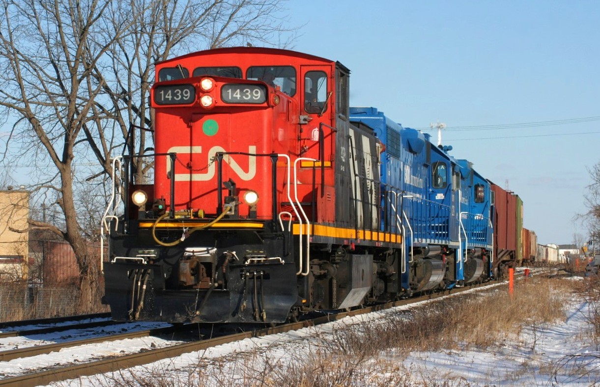 CN L568 with 1439 in the lead switches the Kitchener yard on a sunny winter afternoon. The trailing units were GMTX's 2279 and 2289.