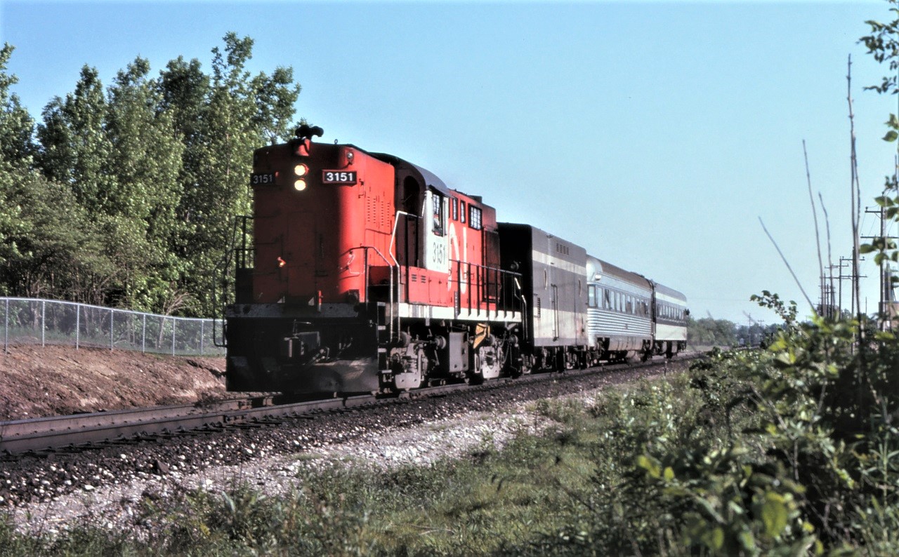 CN 3151, a steam generator car, a former Crusader coach, and a standard coach make up the entire consist of CN's Friday only train 97 as it approaches Richmond Hill, Ontario.  The right of way has been prepared for the soon to be added second track at this location to accommodate GO service.