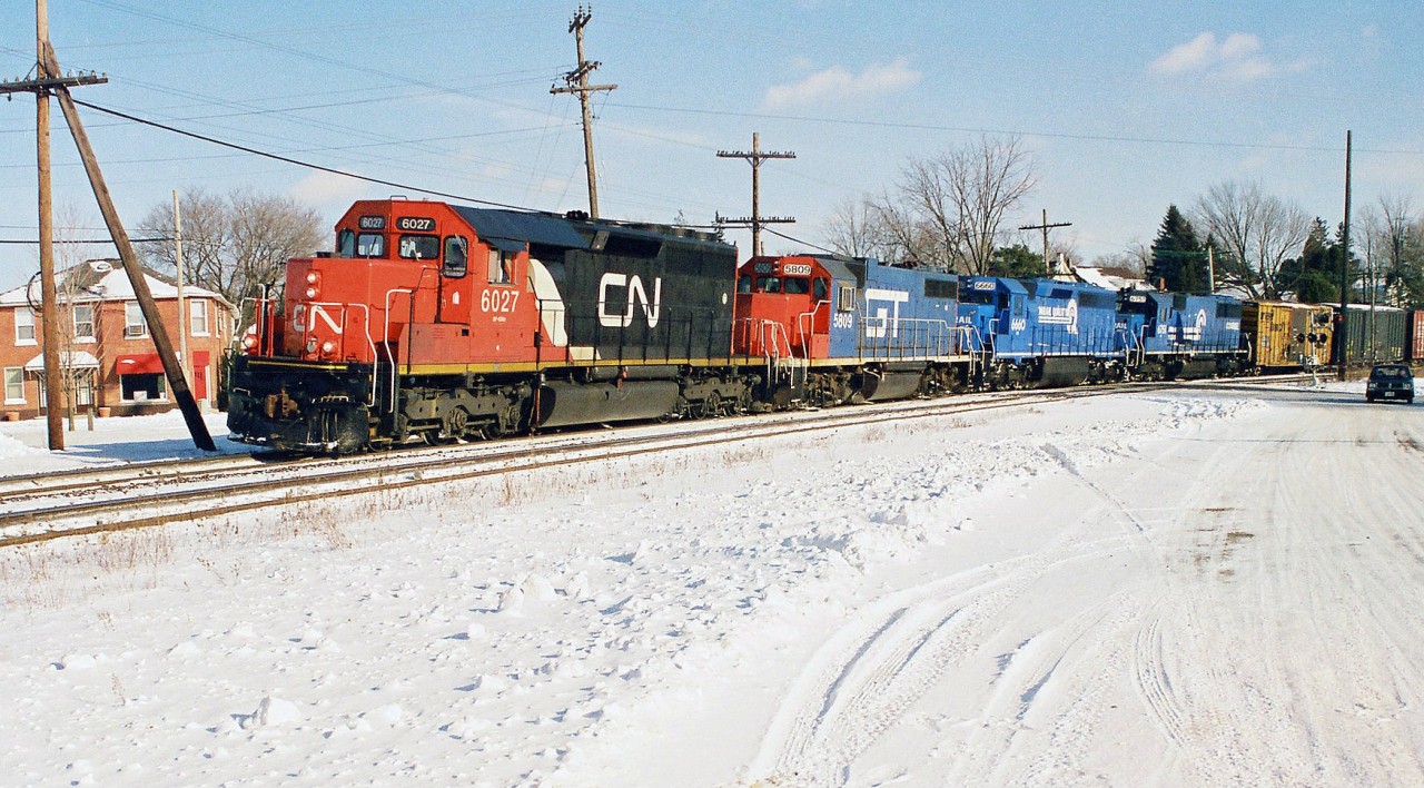 After a fun chase from Copetown to Paris, things became even more rewarding as CN 391 began slowing down as it crossed the Grand River bridge in Paris on the Dundas Subdivision as seen here.

http://www.railpictures.ca/?attachment_id=40621

The lengthy train would eventually come to a stop at the Market Street crossing in Paris to allow VIA Rail #73 to scoop it. This gave photographers ample time to enjoy the consist that included;  6027, GT 5809, Conrail’s 6660 and 6751. Conrail SD45-2 6660 was on lease to power-short CN while SD50 6751 was working-off horsepower hours owed to CN at the time. Once 73 had cleared Pairs West, CN 391 eventually got the light to proceed westward as pictured here and man did that sound great.
