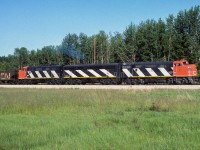 The 9171 has just entered the south end of the connecting track and will head north to the Lac La Biche Sub and on wards to Waterways. For a train geek, having the connecting track installed was a great asset if you lived in Redwater. It pretty much doubled the number of trains per week through town and made consists like this easy prey for the camera. <br> Take care everyone as we head into several weeks of isolated living.