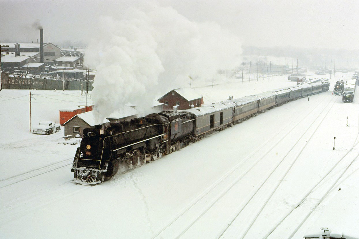 After an overnight snowfall, CN 4-8-4 6218 enters the Hamilton station on its way from Toronto to Paris, Hamilton and Caledonia. The return trip was via the Dundas sub mainline through Brantford.
