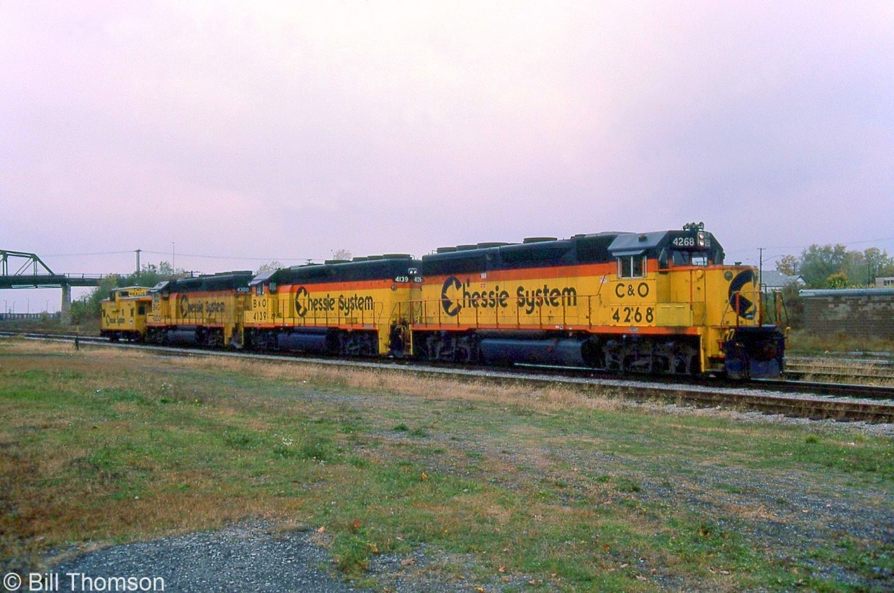 A trio of matching Chessie-painted CSX units are shown at Fort Erie on October 17th 1985. C&O GP40-2 4268 leads B&O GP40 4139 and GP40-2 4300, with a C&O van trailing the lashup.