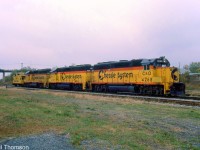 A trio of matching Chessie-painted CSX units are shown at Fort Erie on October 17th 1985. C&O GP40-2 4268 leads B&O GP40 4139 and GP40-2 4300, with a C&O van trailing the lashup.