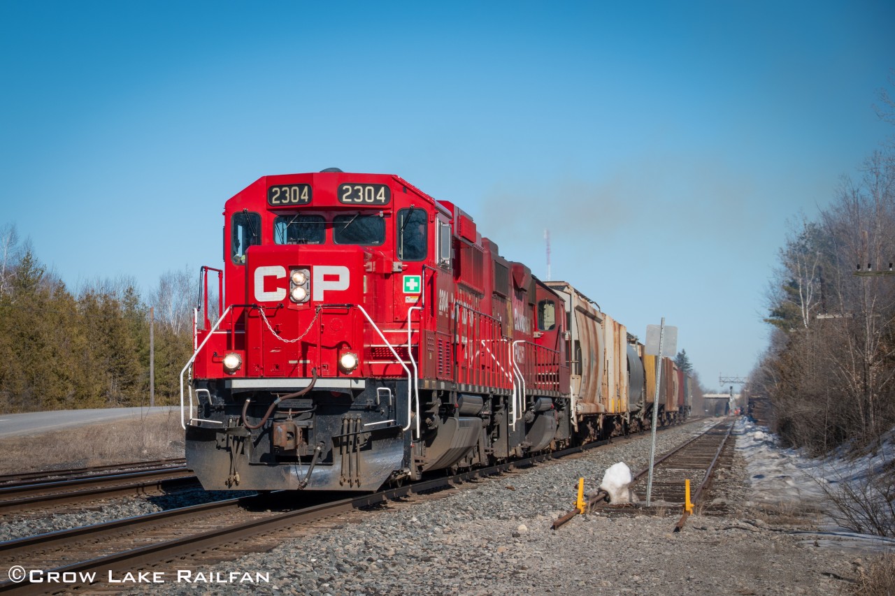 CP F52 throttles up as it comes off the Prescott spur and heads back to the Smiths Falls yard. CP 3100 would cover us in smoke after it passed.